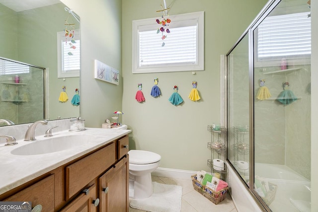 bathroom featuring plenty of natural light, tile patterned flooring, and toilet
