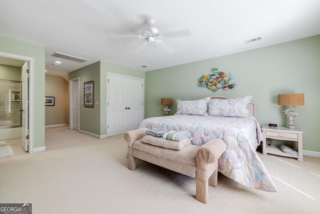 bedroom featuring baseboards, light colored carpet, visible vents, and a closet