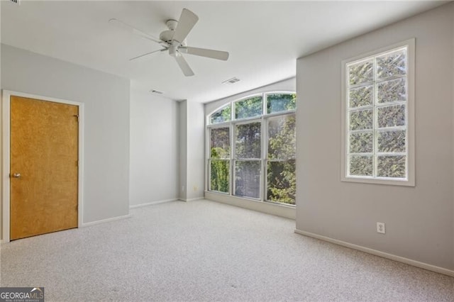 1294 Fernwood Cir NE, Brookhaven, GA 30319 - carpeted empty room with baseboards, a ceiling fan, and visible vents