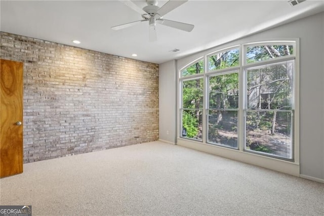 1294 Fernwood Cir NE, Brookhaven, GA 30319 - carpeted spare room featuring a ceiling fan, recessed lighting, and brick wall