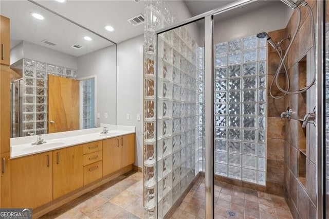 1294 Fernwood Cir NE, Brookhaven, GA 30319 - bathroom featuring visible vents, a sink, and a stall shower