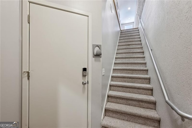 1294 Fernwood Cir NE, Brookhaven, GA 30319 - staircase featuring a textured wall