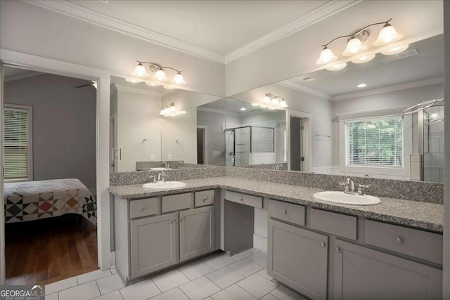 full bathroom featuring tile patterned flooring, crown molding, vanity, and a shower stall