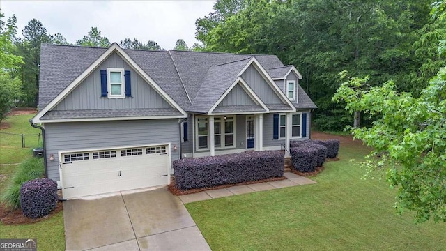 craftsman inspired home featuring fence, a front yard, roof with shingles, board and batten siding, and concrete driveway