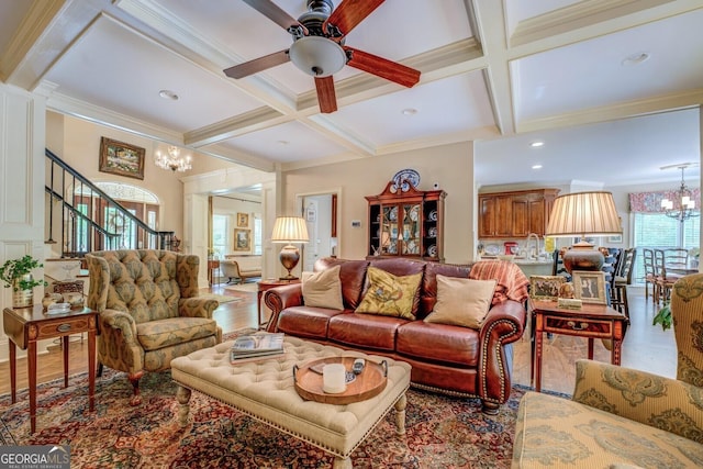 living area featuring stairs, beamed ceiling, crown molding, and coffered ceiling