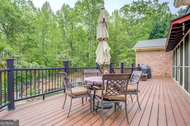 deck featuring outdoor dining area