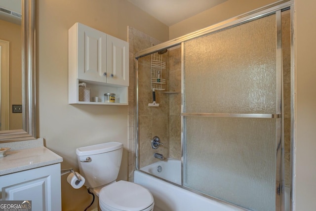 full bath featuring vanity, enclosed tub / shower combo, toilet, and visible vents