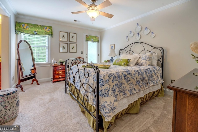 bedroom featuring a ceiling fan, visible vents, light colored carpet, baseboards, and ornamental molding