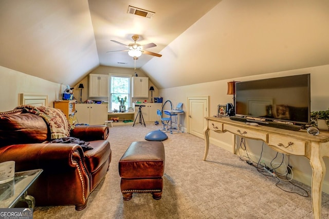 interior space with visible vents, baseboards, ceiling fan, and vaulted ceiling