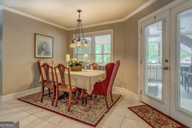 dining space featuring ornamental molding, light tile patterned flooring, and a healthy amount of sunlight