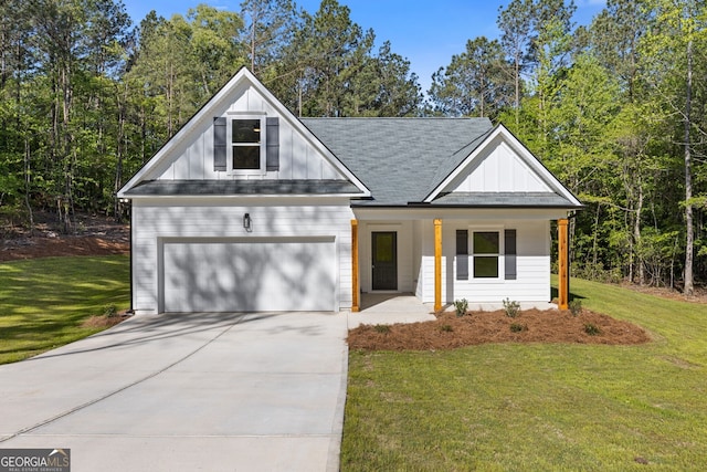 1488 Campbell Rd, Covington, GA 30014 - view of front of house featuring a porch, a front lawn, board and batten siding, and driveway
