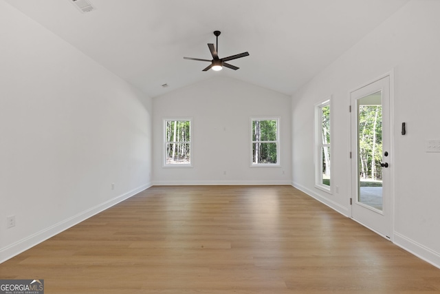 1488 Campbell Rd, Covington, GA 30014 - interior space featuring vaulted ceiling, baseboards, a ceiling fan, and light wood finished floors