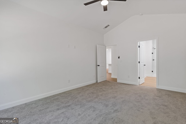 1488 Campbell Rd, Covington, GA 30014 - unfurnished bedroom with visible vents, baseboards, high vaulted ceiling, carpet, and ensuite bath
