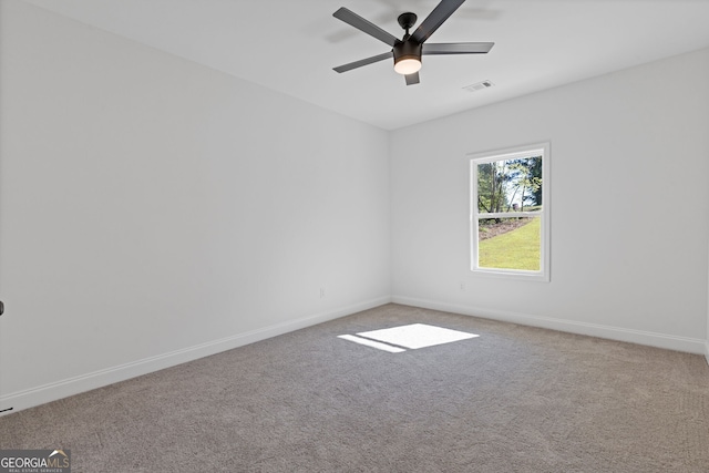 1488 Campbell Rd, Covington, GA 30014 - spare room featuring carpet floors, baseboards, ceiling fan, and visible vents