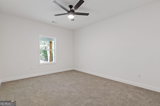 1488 Campbell Rd, Covington, GA 30014 - carpeted empty room with baseboards, ceiling fan, and visible vents