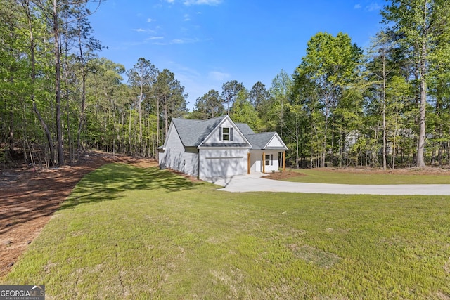 1488 Campbell Rd, Covington, GA 30014 - view of front of house featuring concrete driveway, an attached garage, and a front yard