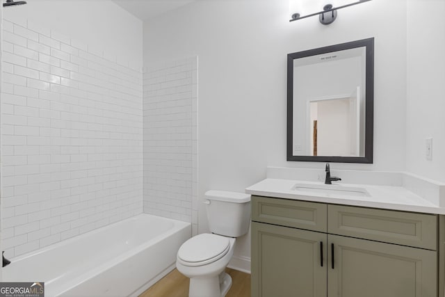 1488 Campbell Rd, Covington, GA 30014 - full bathroom featuring vanity,  shower combination, wood finished floors, and toilet