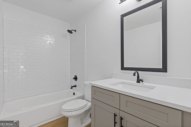 1488 Campbell Rd, Covington, GA 30014 - full bath featuring toilet, washtub / shower combination, wood finished floors, and vanity