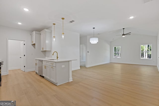1488 Campbell Rd, Covington, GA 30014 - kitchen featuring dishwasher, light countertops, a ceiling fan, baseboards, and light wood-type flooring
