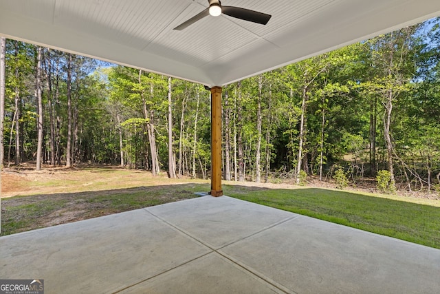 1488 Campbell Rd, Covington, GA 30014 - view of patio / terrace with ceiling fan and a forest view