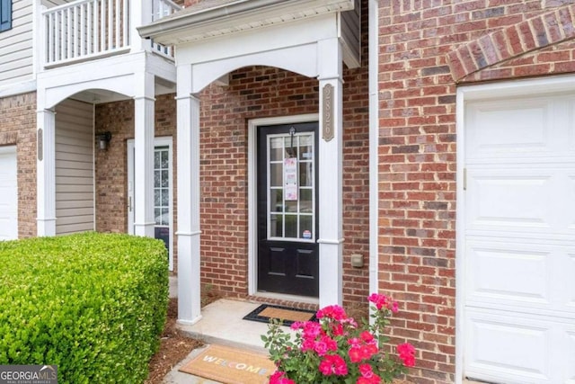 2826 Snapfinger Mnr, Decatur, GA 30035 - townhome / multi-family property with concrete driveway, brick siding, an attached garage, and a balcony