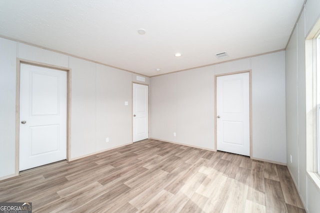 92 Wood Duck Ln, Folkston, GA 31537 - interior space with light wood-style floors, crown molding, and visible vents