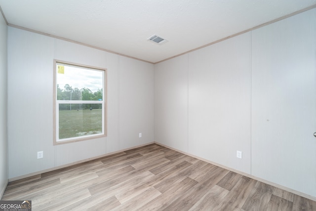 92 Wood Duck Ln, Folkston, GA 31537 - spare room with crown molding, wood finished floors, and visible vents