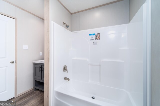 92 Wood Duck Ln, Folkston, GA 31537 - full bath featuring bathtub / shower combination, ornamental molding, wood finished floors, and vanity
