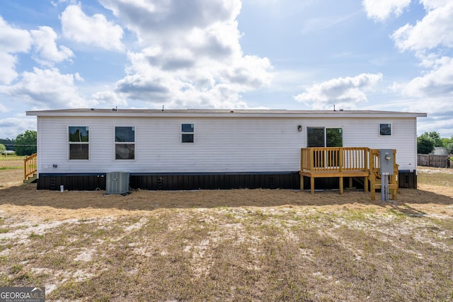 92 Wood Duck Ln, Folkston, GA 31537 - rear view of house featuring central AC unit and a wooden deck