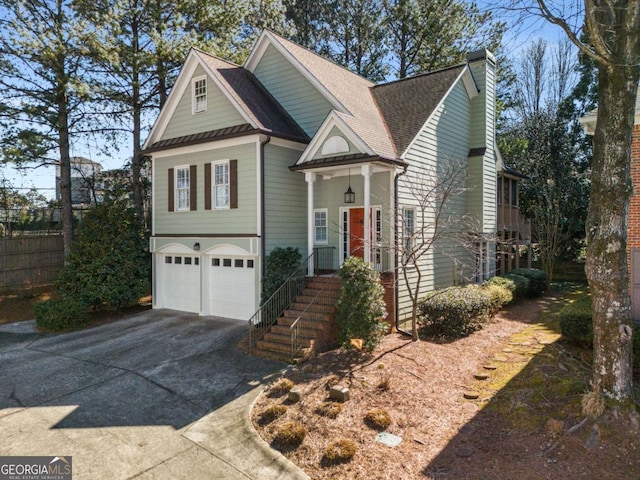 5 Renfroe Ct, Decatur, GA 30030 - view of front facade with driveway, a garage, roof with shingles, and a chimney