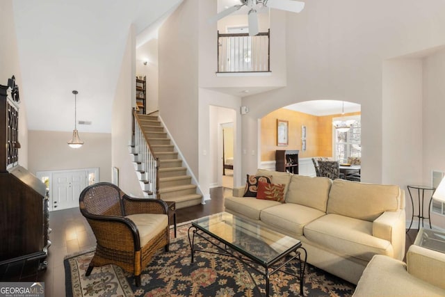 5 Renfroe Ct, Decatur, GA 30030 - living area with a towering ceiling, arched walkways, dark wood-type flooring, ceiling fan, and stairs