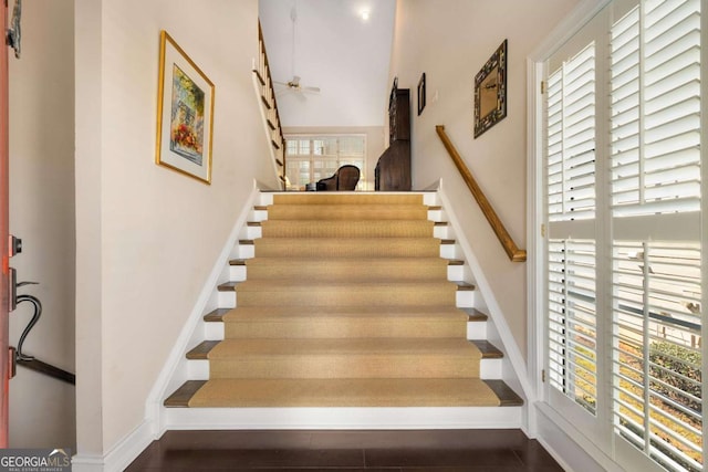 5 Renfroe Ct, Decatur, GA 30030 - stairway featuring a towering ceiling, baseboards, ceiling fan, and wood finished floors