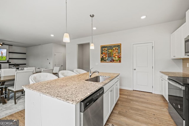 181 Sweet Briar Way, Homer, GA 30547 - kitchen with stainless steel appliances, white cabinetry, light wood-type flooring, light stone counters, and recessed lighting