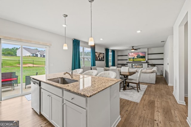 181 Sweet Briar Way, Homer, GA 30547 - kitchen featuring dishwasher, ceiling fan, a kitchen island with sink, light wood-type flooring, and pendant lighting