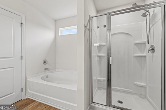 181 Sweet Briar Way, Homer, GA 30547 - bathroom featuring a shower stall, a bath, and wood finished floors