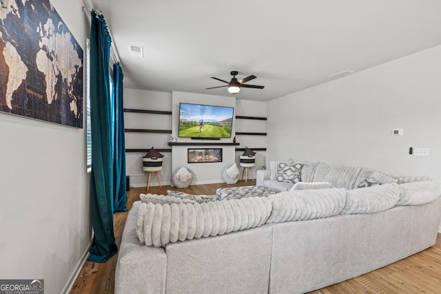181 Sweet Briar Way, Homer, GA 30547 - living room with a ceiling fan, wood finished floors, and a glass covered fireplace