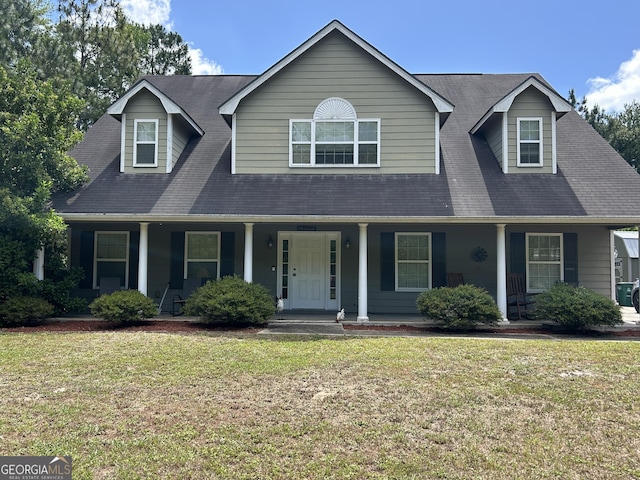 view of front of home featuring covered porch and a front lawn