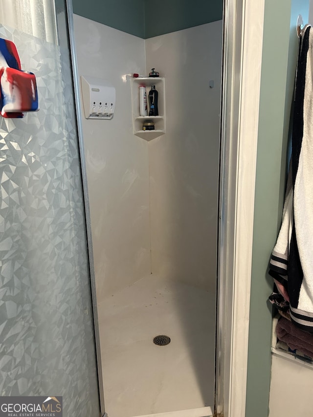 bathroom featuring a shower stall