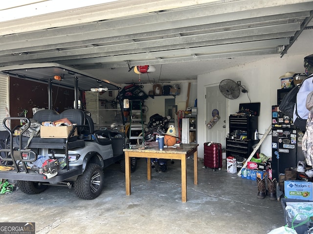 garage featuring a workshop area and a garage door opener