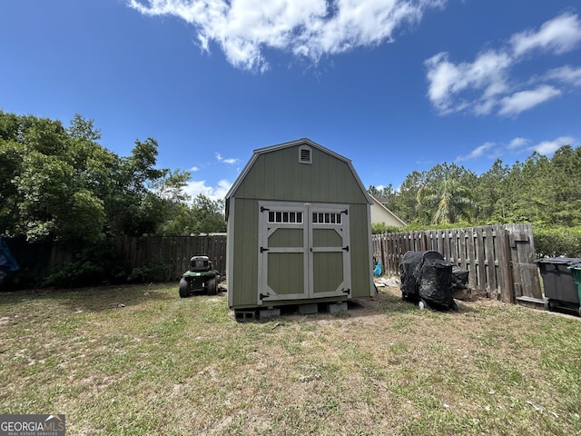 view of shed featuring a fenced backyard