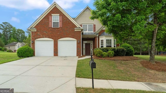 traditional-style home featuring brick siding, driveway, a front yard, and a garage