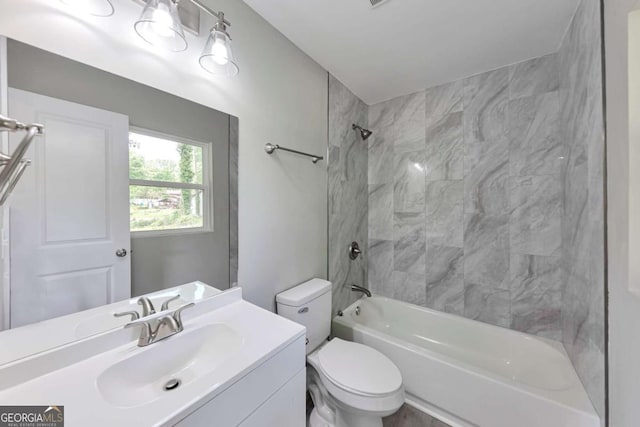 bathroom with bathing tub / shower combination, vanity, and toilet