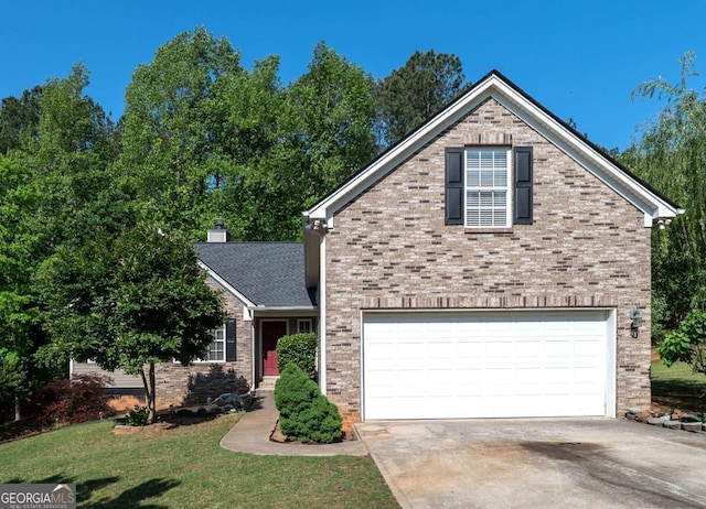 traditional-style house featuring an attached garage, concrete driveway, a front lawn, and brick siding
