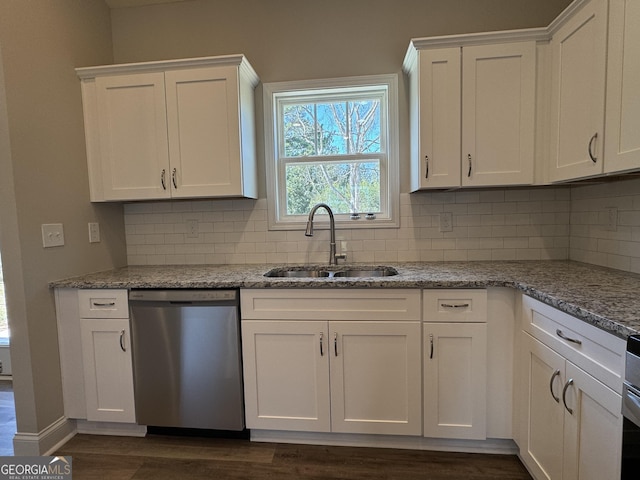 kitchen with a sink, decorative backsplash, dishwasher, and white cabinets