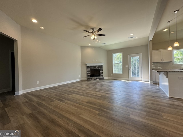 unfurnished living room with dark wood-type flooring, recessed lighting, ceiling fan, and visible vents