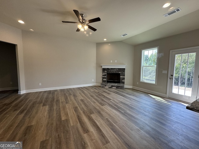 unfurnished living room with baseboards, ceiling fan, dark wood-style floors, and visible vents