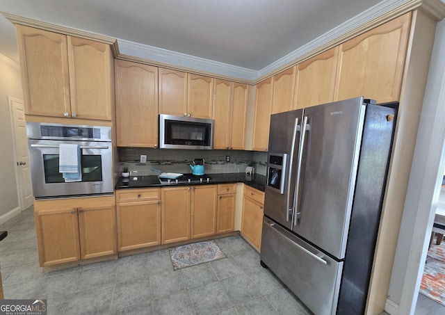 kitchen featuring stainless steel appliances and light brown cabinetry