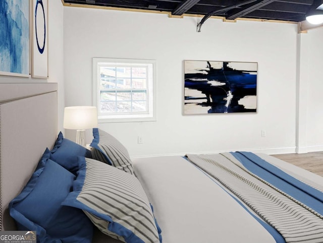 bedroom featuring baseboards