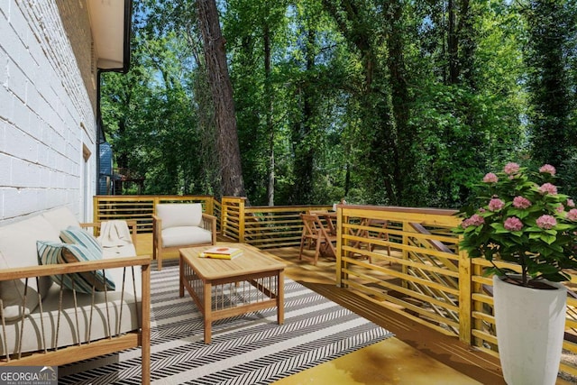 exterior space featuring a deck and outdoor lounge area