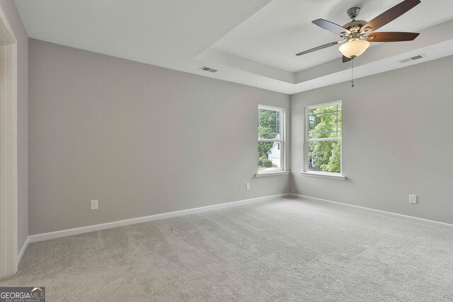 51 Camden Cir, Newnan, GA 30265 - unfurnished room featuring a ceiling fan, baseboards, visible vents, and light carpet